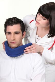 The doctor places the Shants collar on the patient